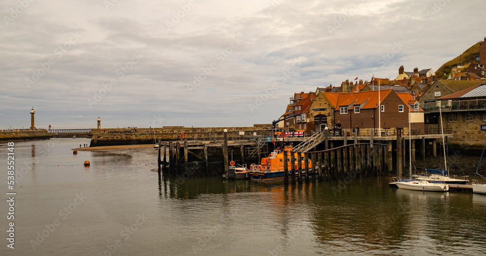 The RNLI lifeboat and lifeboat shed in Whitby harbour Stock Photo ...