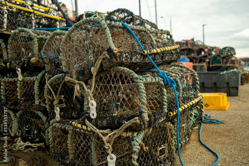 Crab pots, lobster pots and fish traps on the quaside in the seasidde town of Whitby, North Yorkshire