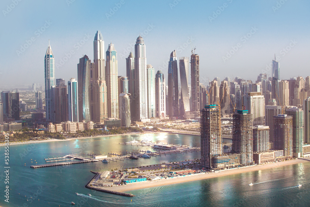 Obraz premium Dubai Marina skyscrapers complex of residential and office buildings at sunset. Dubai, UAE