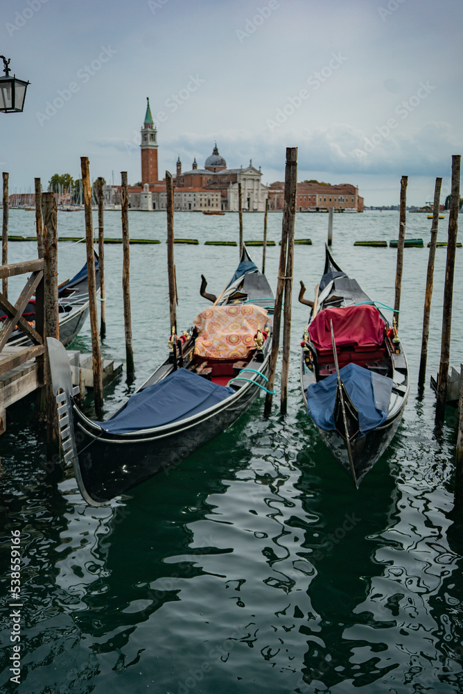 2 gondolas in Venice, cloudy weather