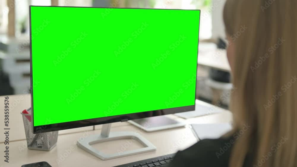 Young Businesswoman Working on Computer with Green Screen Young Businesswoman Working on Computer with Green Screen