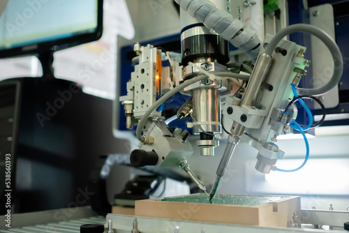 Принти на полотні Soldering machine: process of selective soldering components to printed circuit boards at factory, exhibition
