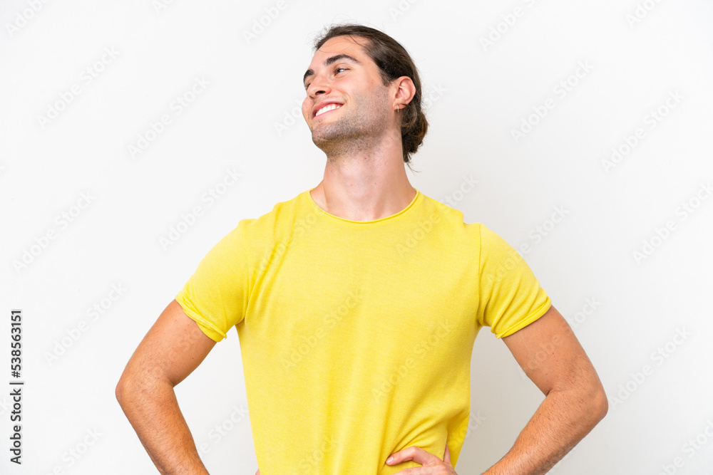 Caucasian handsome man isolated on white background posing with arms at hip and smiling Caucasian handsome man isolated on white background posing with arms at hip and smiling