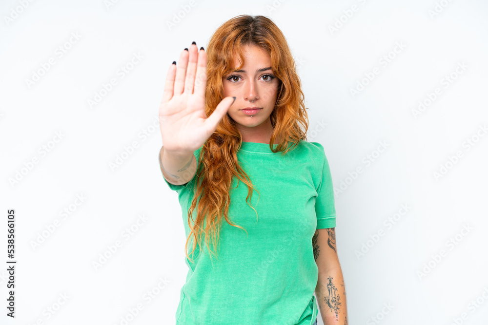 Young caucasian woman isolated on white background making stop gesture Young caucasian woman isolated on white background making stop gesture