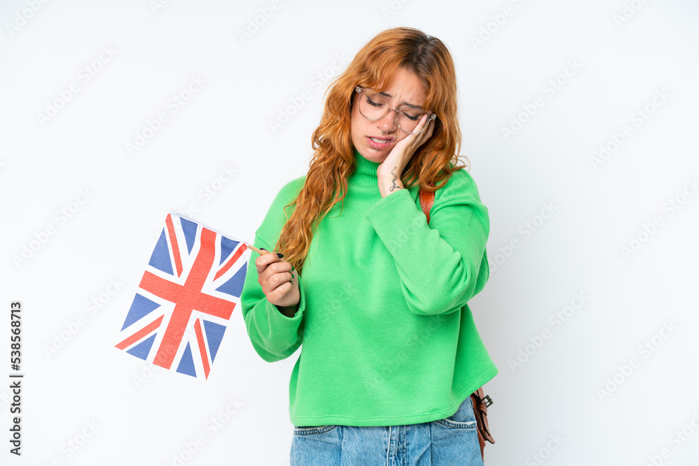 Young caucasian woman holding an United Kingdom flag isolated on white background with headache