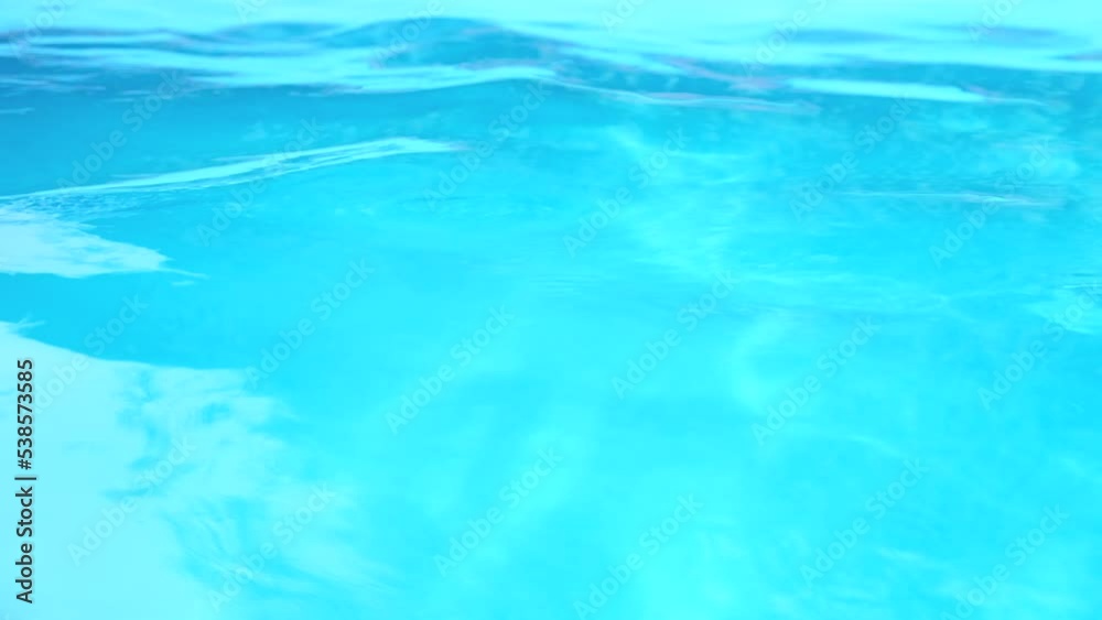 Pool water background. Abstract water background in a swimming pool. Slow motion Pool water background. Abstract water background in a swimming pool. Slow motion