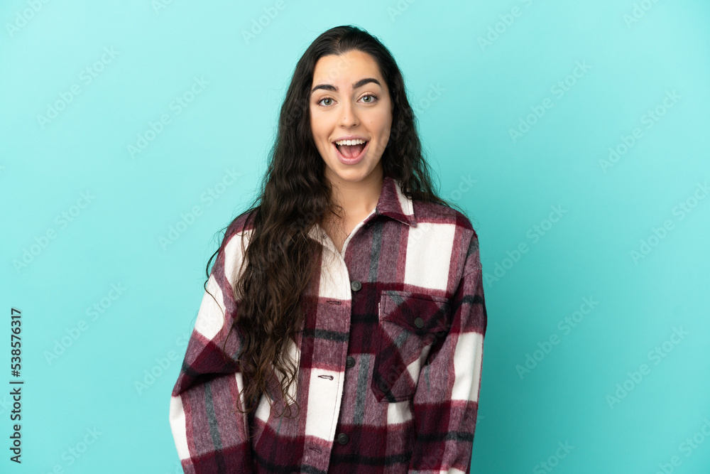 Young caucasian woman isolated on blue background with surprise facial expression Young caucasian woman isolated on blue background with surprise facial expression
