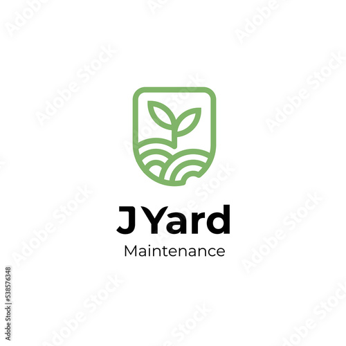 clean yard or garden logo with green soil and plant symbol emblem logo