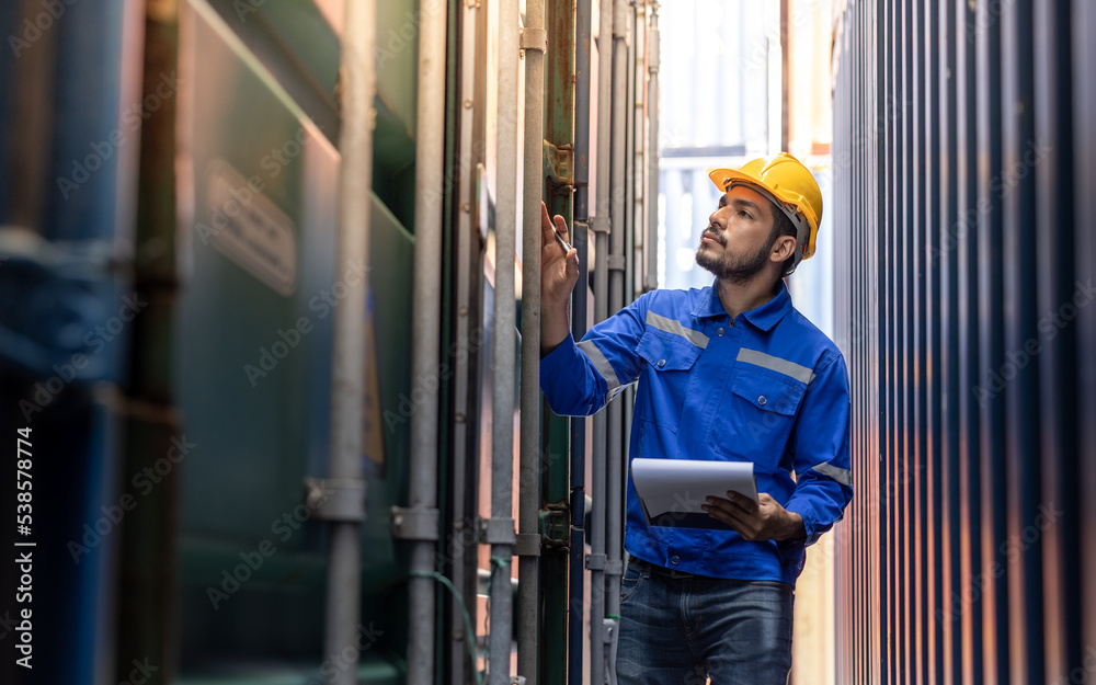 Container operator is performing his daily inspection task in the container yard. Container operator is performing his daily inspection task in the container yard.