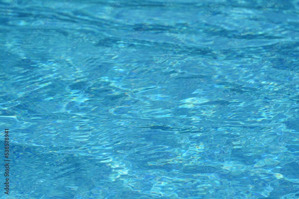 Clear refreshing water in swimming pool on sunny day, closeup Clear refreshing water in swimming pool on sunny day, closeup
