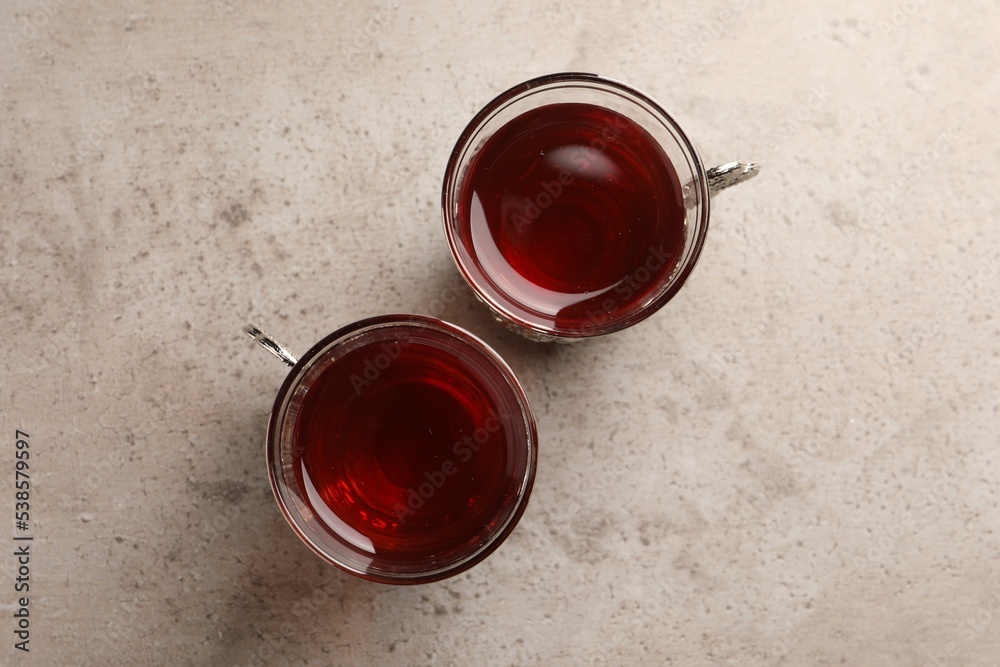 Glasses of traditional Turkish tea on light grey table, flat lay Glasses of traditional Turkish tea on light grey table, flat lay