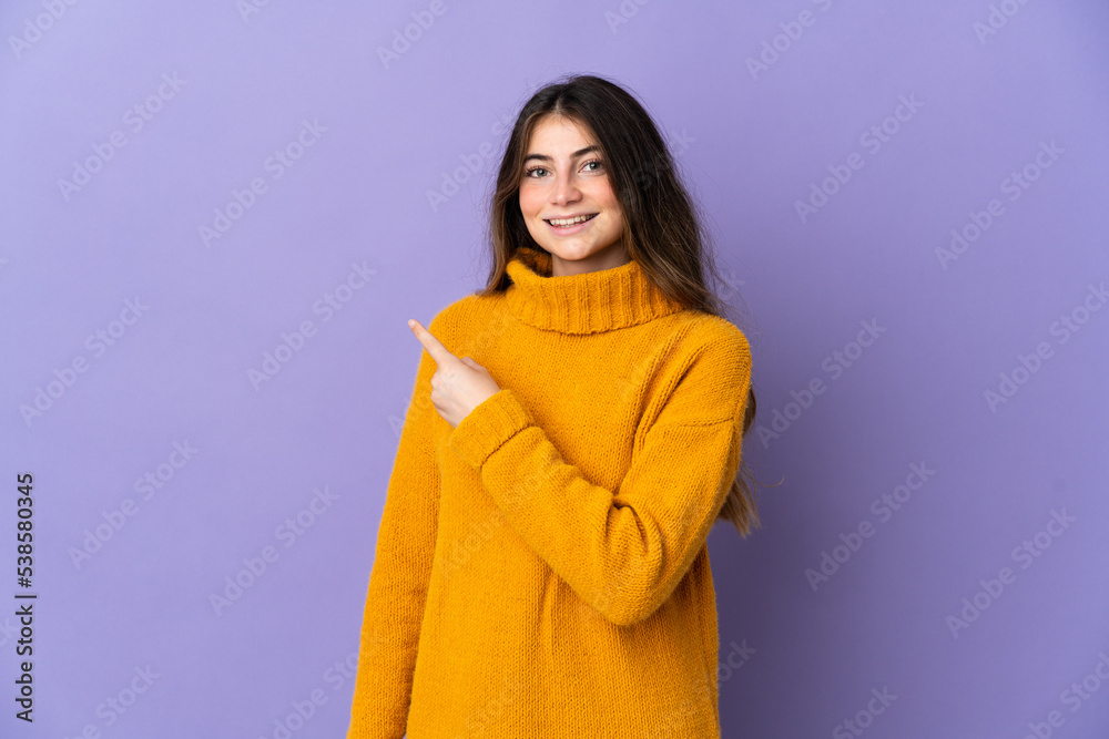 Young caucasian woman isolated on purple background pointing to the side to present a product Young caucasian woman isolated on purple background pointing to the side to present a product