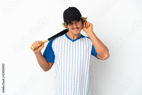 Young blonde man playing baseball isolated on white background frustrated and covering ears