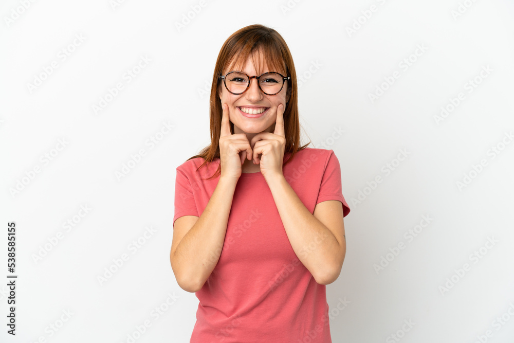 Redhead girl isolated on white background smiling with a happy and pleasant expression Redhead girl isolated on white background smiling with a happy and pleasant expression