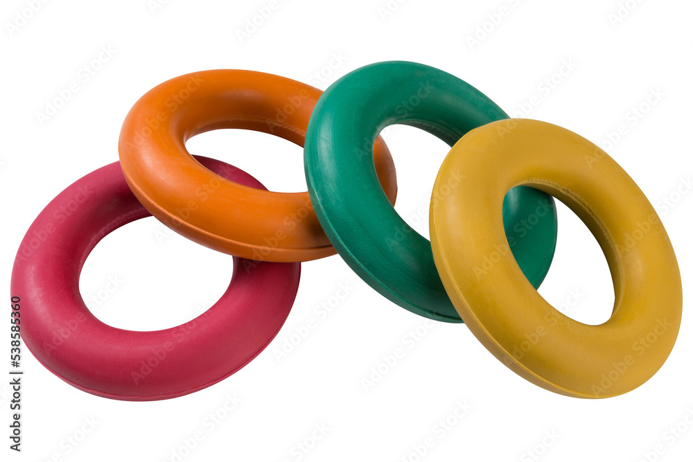 Four colored carpal expanders, lie one on top of the other, on a white background, concept, isolate Four colored carpal expanders, lie one on top of the other, on a white background, concept, isolate