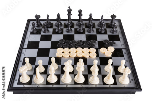Chess and checkers are arranged on a board with gray and black cells, a set of board games, on a white background, isolate