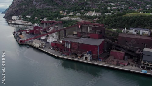 modern safe chemical production plant on the shore of the fjord, aerial view photo