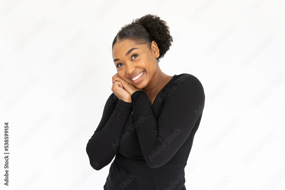 Portrait of admiring young woman posing against white background. African American lady wearing black longsleeve looking at camera with love and excitement. Admiration concept Portrait of admiring young woman posing against white background. African American lady wearing black longsleeve looking at camera with love and excitement. Admiration concept