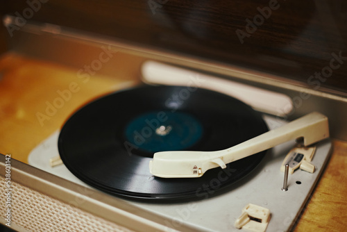 Istra, Russia - September 06, 2021: Vinyl record, spinning on a turntable, Vintage record player with radio 60's.