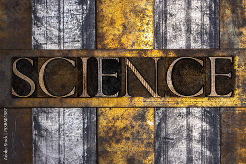 Science text on grunge textured copper and gold background