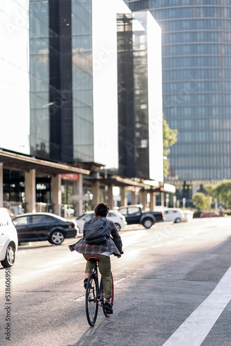 Man Riding Bike in the City © santypan