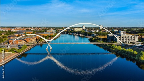 Aerial view of the Infinity Bridge spanning the river Tees in Stockton, California photo