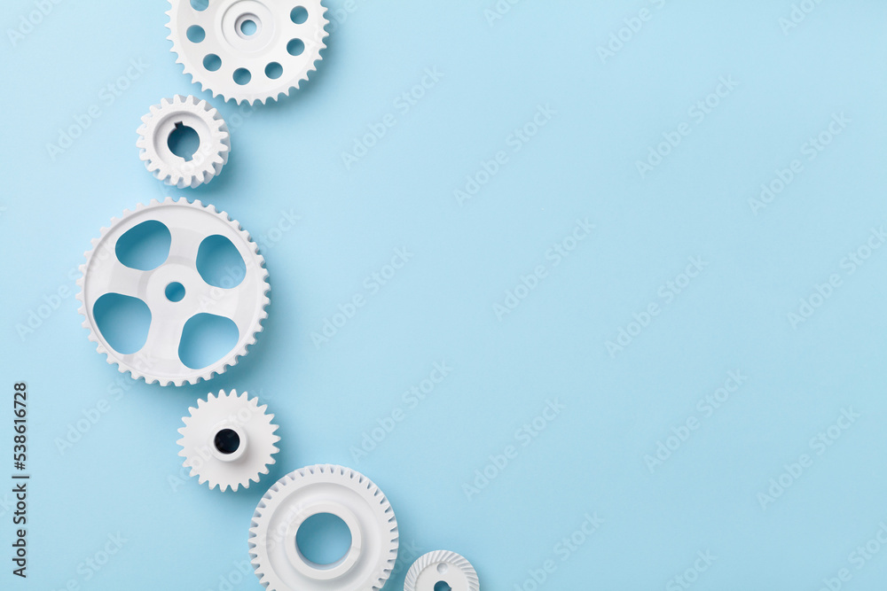 White gears wheels flat lay symbolizing idea, cooperation or teamwork, work and connection concept White gears wheels flat lay symbolizing idea, cooperation or teamwork, work and connection concept