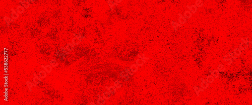 Red powder explosion on black background. Freeze motion of Red dust particles splash, grunge background texture for banner, backdrop.