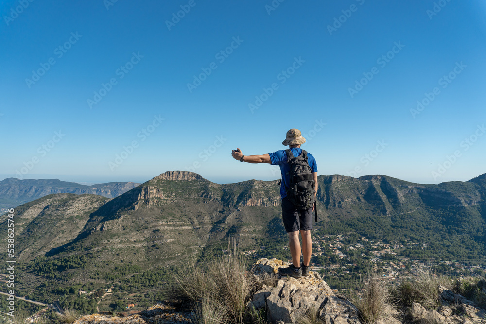 Young mountaineer man, on top of the mountain Young mountaineer man, on top of the mountain