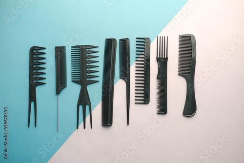 overhead view of Professional combs on color background 