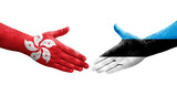Handshake between Estonia and Hong Kong flags painted on hands, isolated transparent image.
