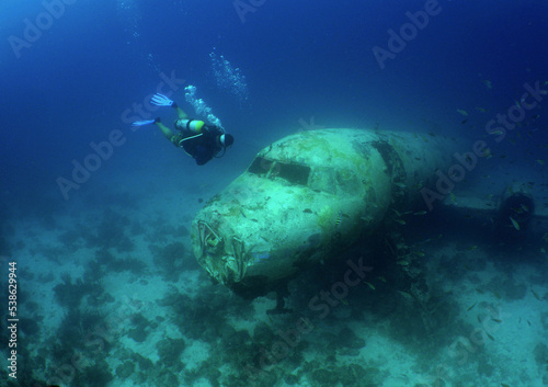 Obraz na plátně a passenger plane sunk on the island of Aruba and divers visiting the wreck