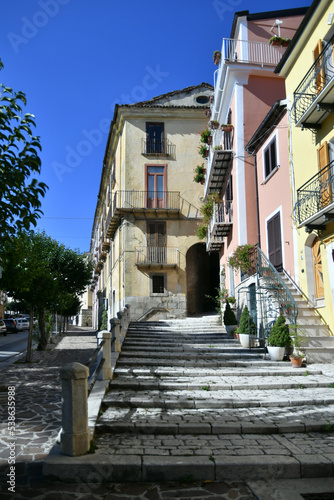 A narrow street between the old stone houses of Frosolone  a medieval village in the Molise region of Italy.