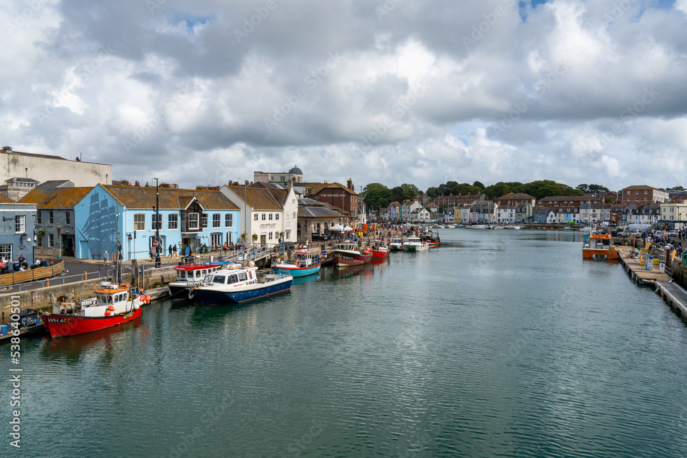 downtown Weymouth and fishing boats on the River Wey in Dorchester