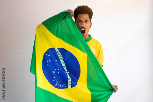 Brazilian Black Man Fan with Soccer Team Shirt Isolated on White.