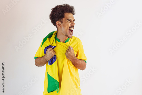 Brazilian Black Man Fan with Soccer Team Shirt Isolated on White.