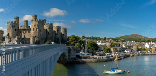 panorama view of the Conwy Castle and bridge with the walled town and harbor behind