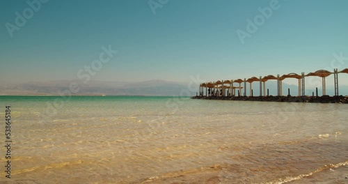 Rest on the shores of the Dead Sea. The bottom is covered with salt.
