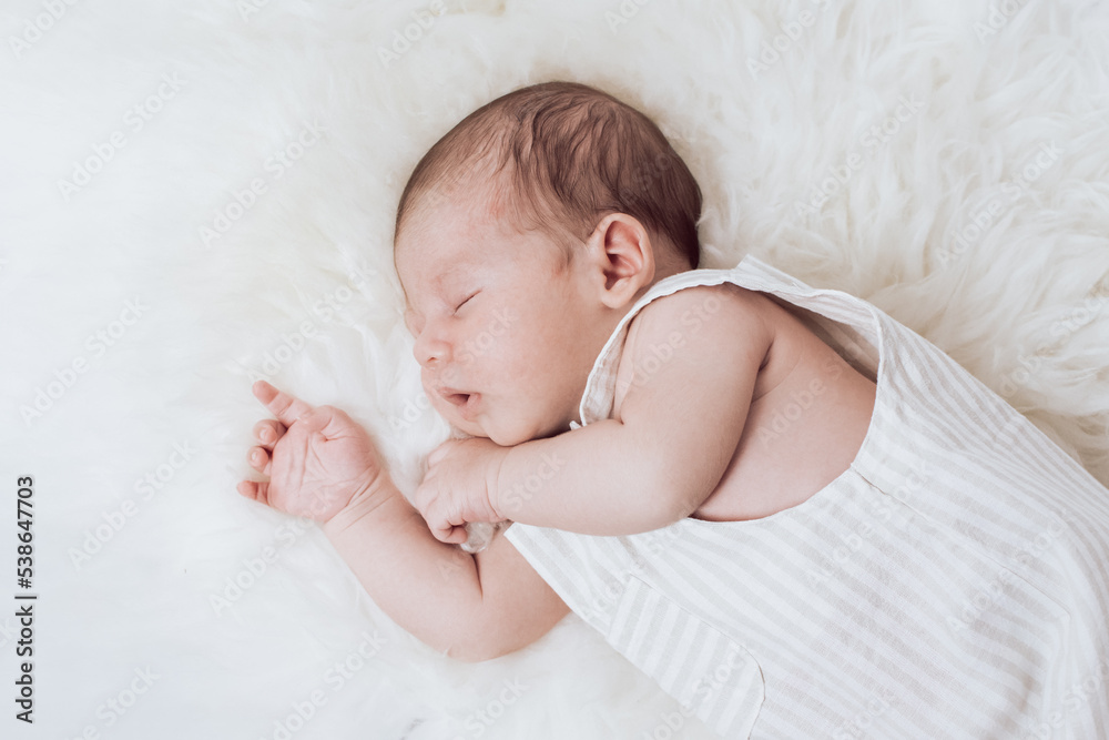 portrait of a sleeping baby lying on a fur portrait of a sleeping baby lying on a fur