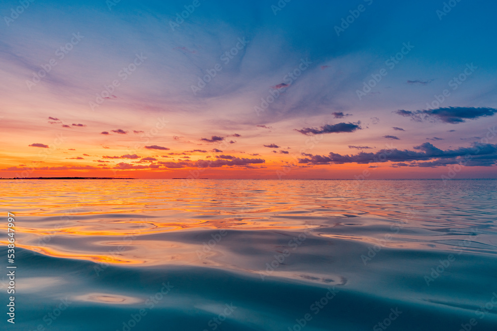 Beautiful sunset ocean water surface. Tranquil summer meditation relaxing seascape. Exotic sunrise beach sun rays, sea and horizon. Amazing nature view, waves colorful sky. Majestic beach coast shore 
