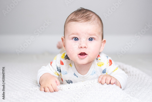 baby in prone position facing forward