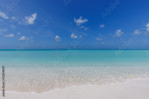 Freedom beach. Closeup white sand, calm blue sea, sunny sky. Seascape horizon. Beautiful outdoor nature scenic, tropical Mediterranean ocean shore. Beautiful tranquil coastline, relax island paradise. © icemanphotos