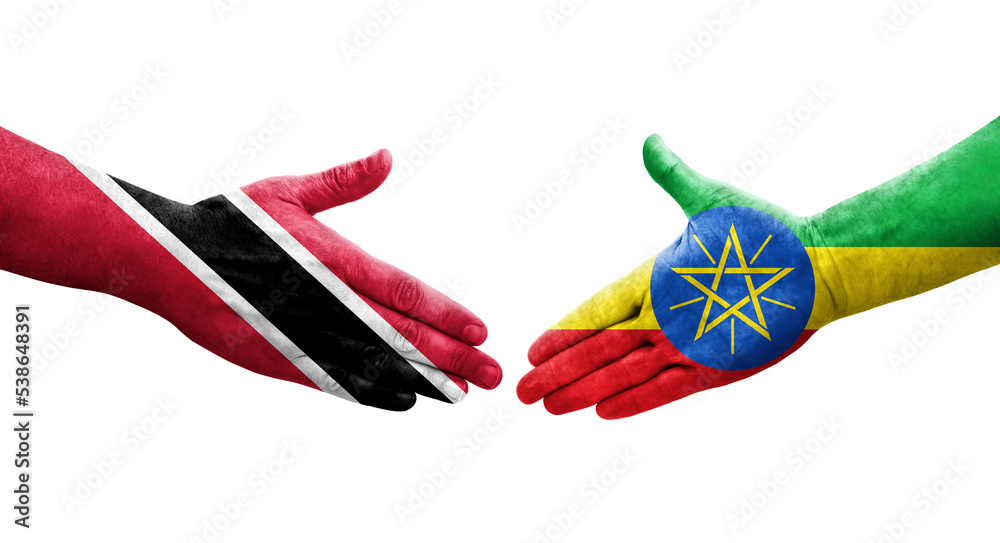 Handshake between Ethiopia and Trinidad Tobago flags painted on hands, isolated transparent image.