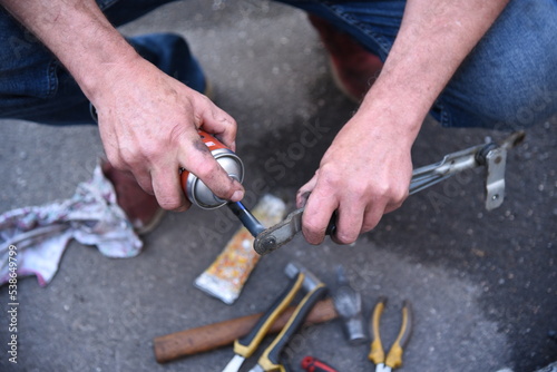 Male hands of a car mechanic with tools in outdoor work © Шамиль Алиев