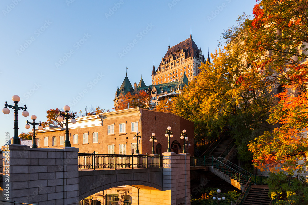 Fototapeta premium View from the Montmorency Park National Historic Site of Canada towards the Prescott Gate over Côte de la Montagne and old town buildings during a colourful sunny fall morning, Quebec City, Quebec