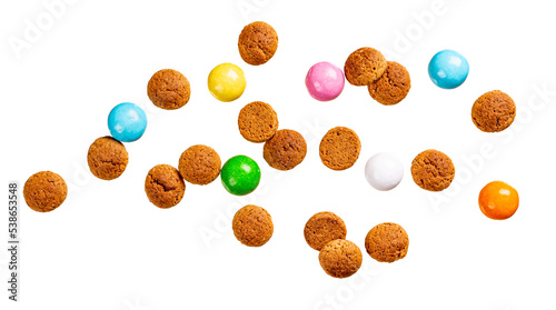 Dutch holiday Sinterklaas greetings card with flying kruidnoten cookies isolated over white. Pepernoten, traditional sweets, strooigoed