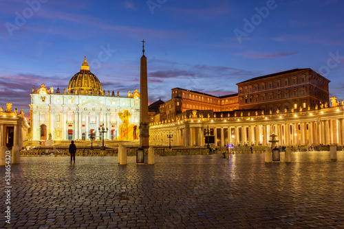 St. Peter's square in Vatican at night, center of Rome, Italy (translation "Follow me")
