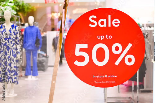 50% off sale sign in shopping center