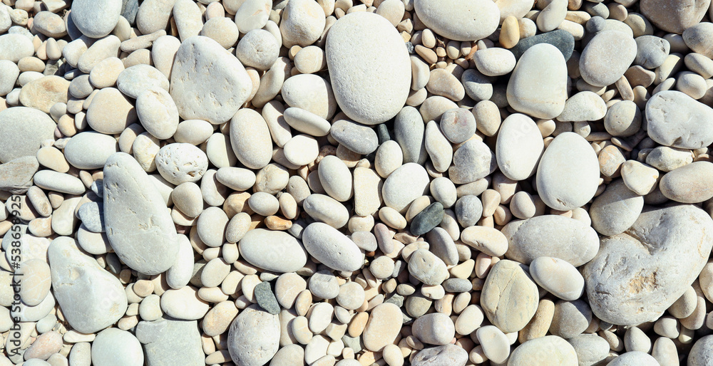 Texture of white sea stones close-up, round smooth stones. For design, background, postcards, collages and compositions Texture of white sea stones close-up, round smooth stones. For design, background, postcards, collages and compositions