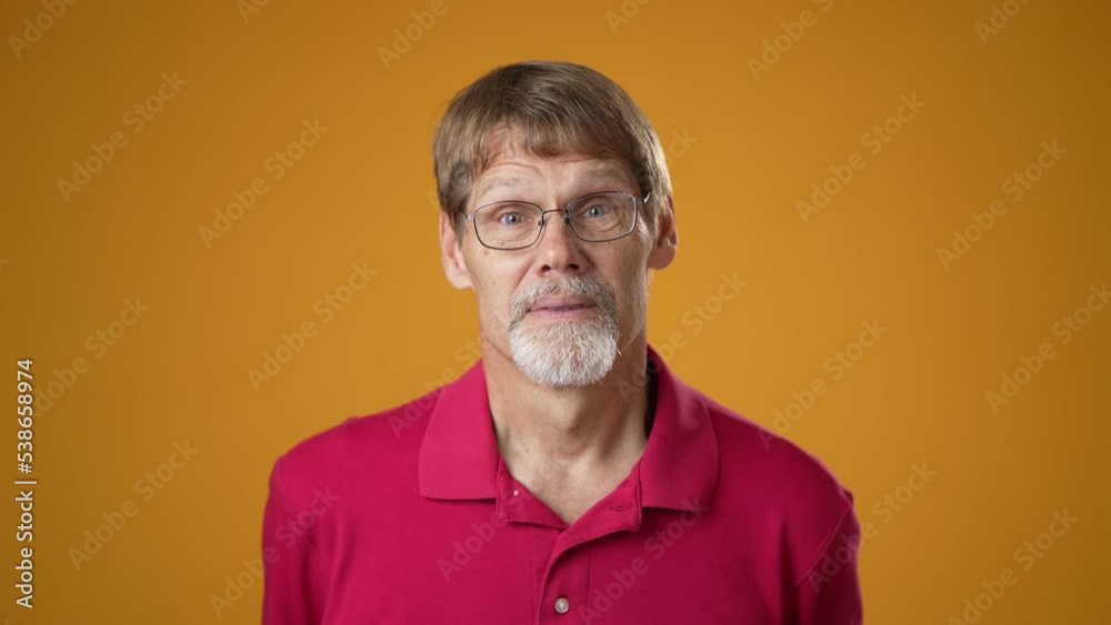 Slow motion portrait of excited jubilant overjoyed mature bearded man 50s 60s doing winner gesture celebrate clenching fists say yes isolated on solid yellow background studio Slow motion portrait of excited jubilant overjoyed mature bearded man 50s 60s doing winner gesture celebrate clenching fists say yes isolated on solid yellow background studio